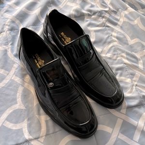 Black “patent leather” (man made materials) New, never worn size 9 (or 260)